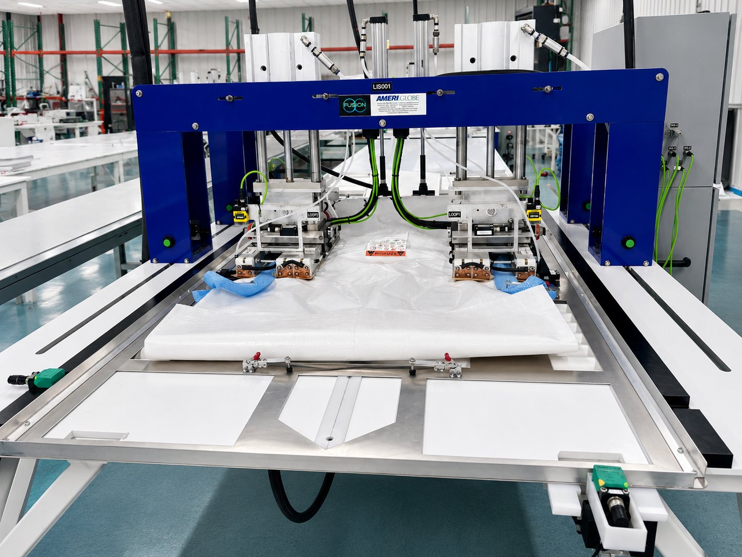 AmeriGlobe's Fusion&reg; lift-loop sealing machine heat-sealing lift loops onto a bag body